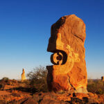 Sunlit stone sculpture in the Australian outback.